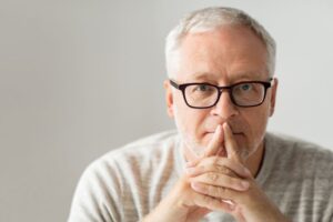 Mature man wearing thoughtful expression